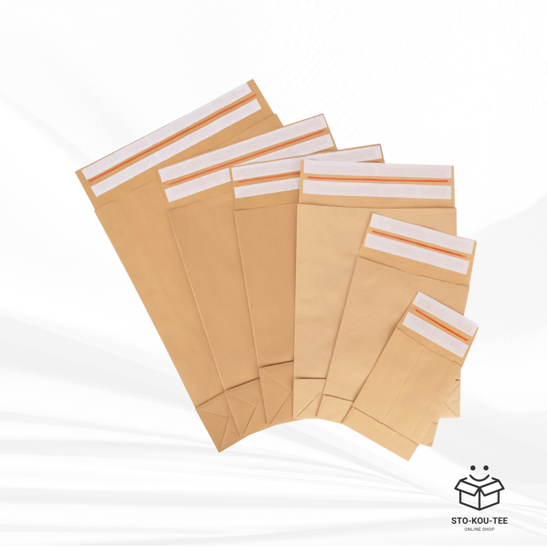Folding bags with double adhesive and tear strip